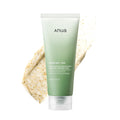 Green tube of anua skincare product with a scrub on a white background