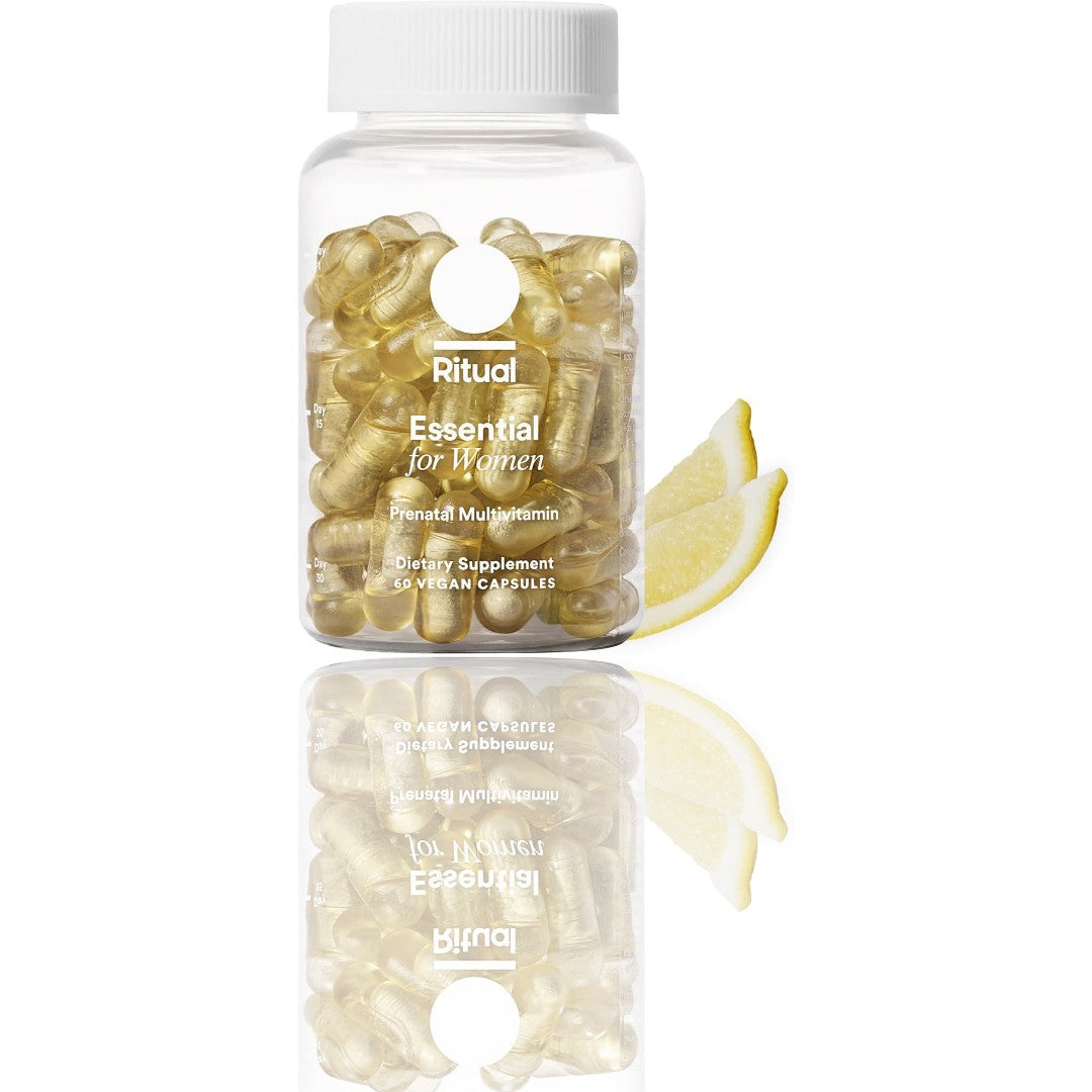 Supplement bottle labeled 'Ritual Essential for Women' with a lemon wedge on a white background