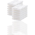 Stack of white textured towels on a white background