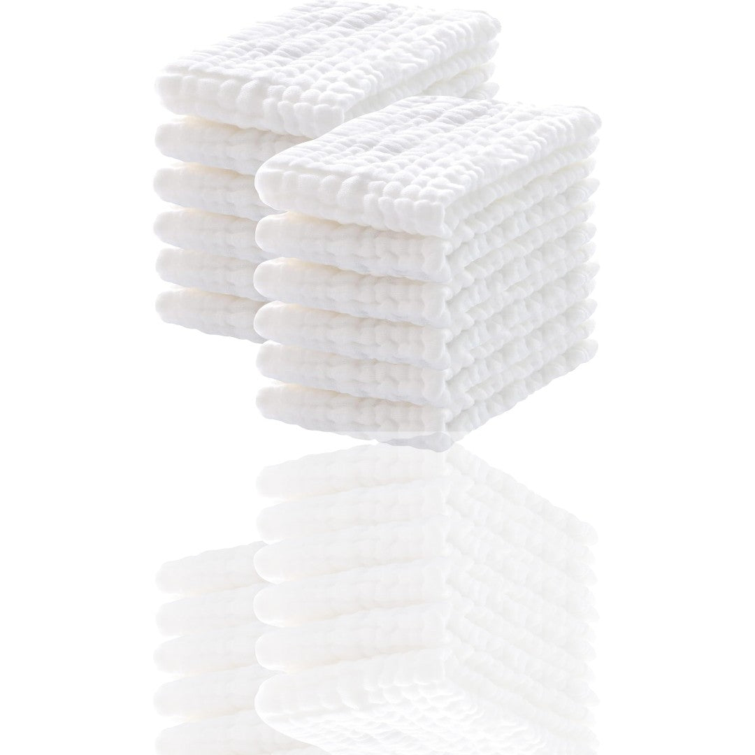 Stack of white textured towels on a white background
