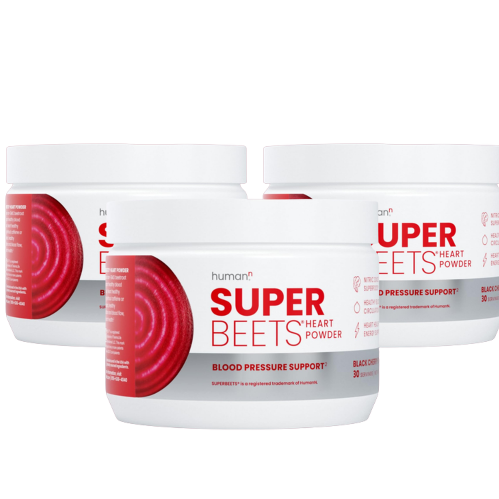 Three containers of Super Beets human+ super heart powder on a white background